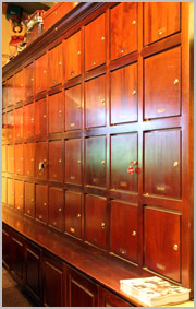 Wall of cabinets at Telford's Pipe & Cigar